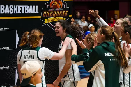 Emma Shumate celebrates at Cherokee Invitational