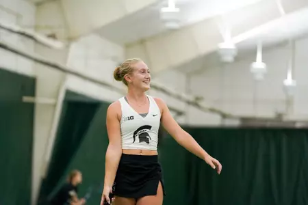 Ellie Blackford smiles during doubles match