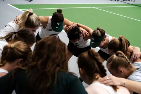 Women's Tennis Team Huddle