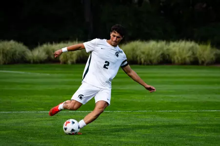 Will Eby strikes ball against Wisconsin