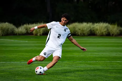 Will Eby strikes ball against Wisconsin