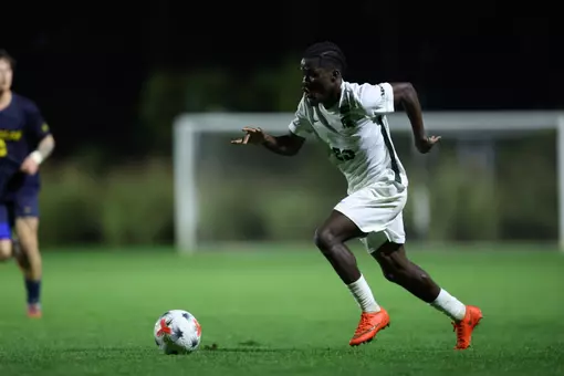 Leo Conneh strikes the ball against Michigan
