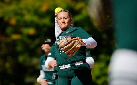 Violet Flynn warms up before a game at Secchia Stadium