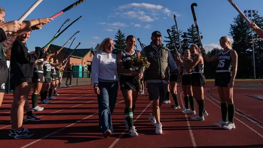 Bianca Pizano walks with her family during the senior celebration
