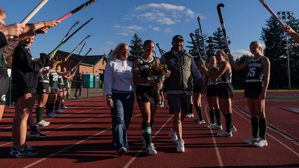 Bianca Pizano walks with her family during the senior celebration