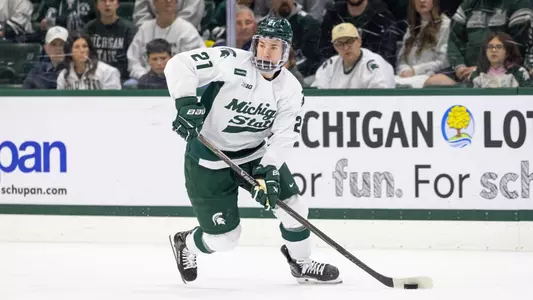 Cullen Potter handles the puck at Munn Ice Arena