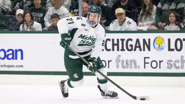 Cullen Potter handles the puck at Munn Ice Arena