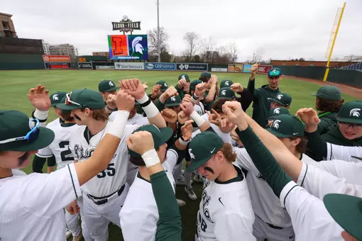 Team huddle vs Illinois at Fluor Field Greenville