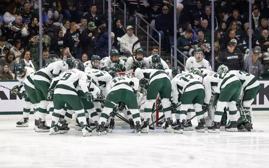 Michigan State hockey huddles before game against Ohio State