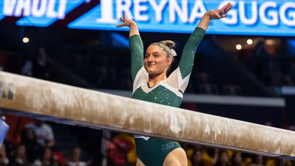 Isabella Trostel finishes a beam routine at the Big Ten Championships