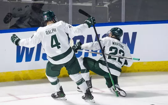 Porter Martone and Colin Ralph celebrate after a Martone goal in the NCAA Tournament against UConn