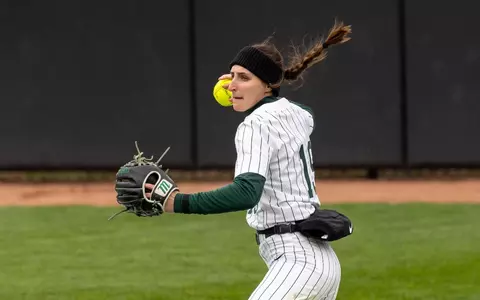 Sydney Doloszycki makes a throw from her position in center field.