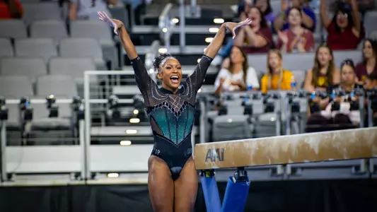 Nikki Smith celebrates after a beam routine at the NCAA Gymnastics Championships