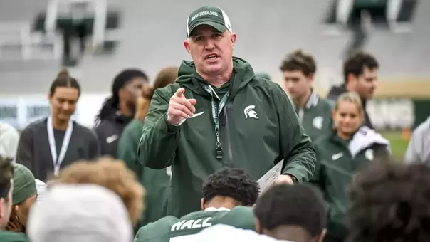 Michigan State head football coach Pat Fitzgerald addresses the team following the 2026 spring showcase in Spartan Stadium.