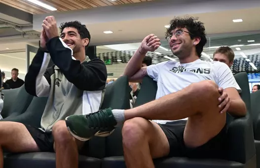 Taym Alazmeh and Ozan Baris celebrate the announcement of Michigan State men's tennis in the NCAA Tournament at the Selection Show watch party in Jenison Field House.