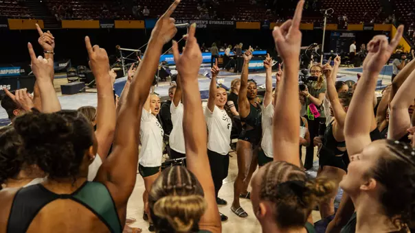 Gymnastics group huddle at NCAA Tempe Regional