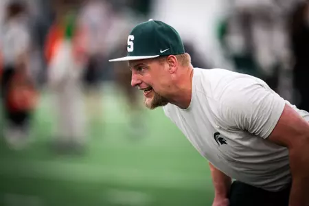 Max Bullough coaches a drill at Michigan State spring practice in March 2026.