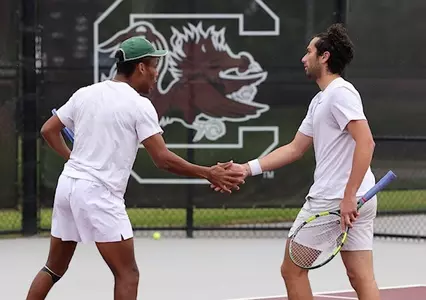 Matthew Forbes and Ozan Baris high five during their doubles match vs North Carolina in the first round of the NCAA Tournament in Columbia, South Carolina, hosted by South Carolina.