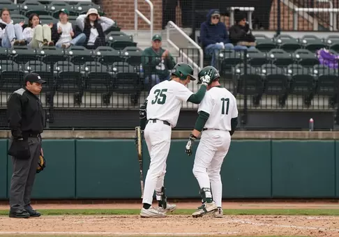 Randy Seymour and Parker Picot celebrate together at home plate after Picot's HR vs EMU on May 12, 2026.