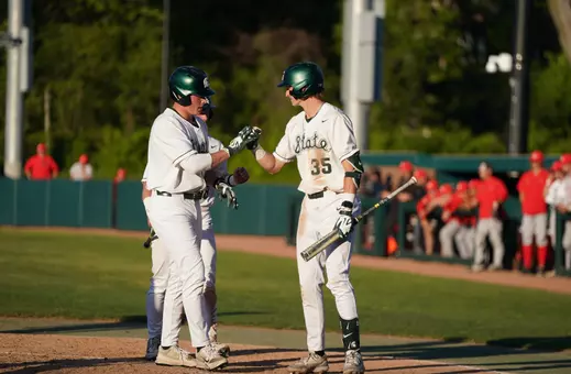 Parker Picot and Randy Seymour celebrate at home plate during game vs. Illinois State on May 14, 2026