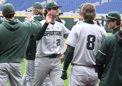 Aidan Donovan is congratulated by teammates during the Big Ten Tournament game vs. Purdue at Charles Schwab Field Omaha in Omaha, Nebraska on May 19, 2026