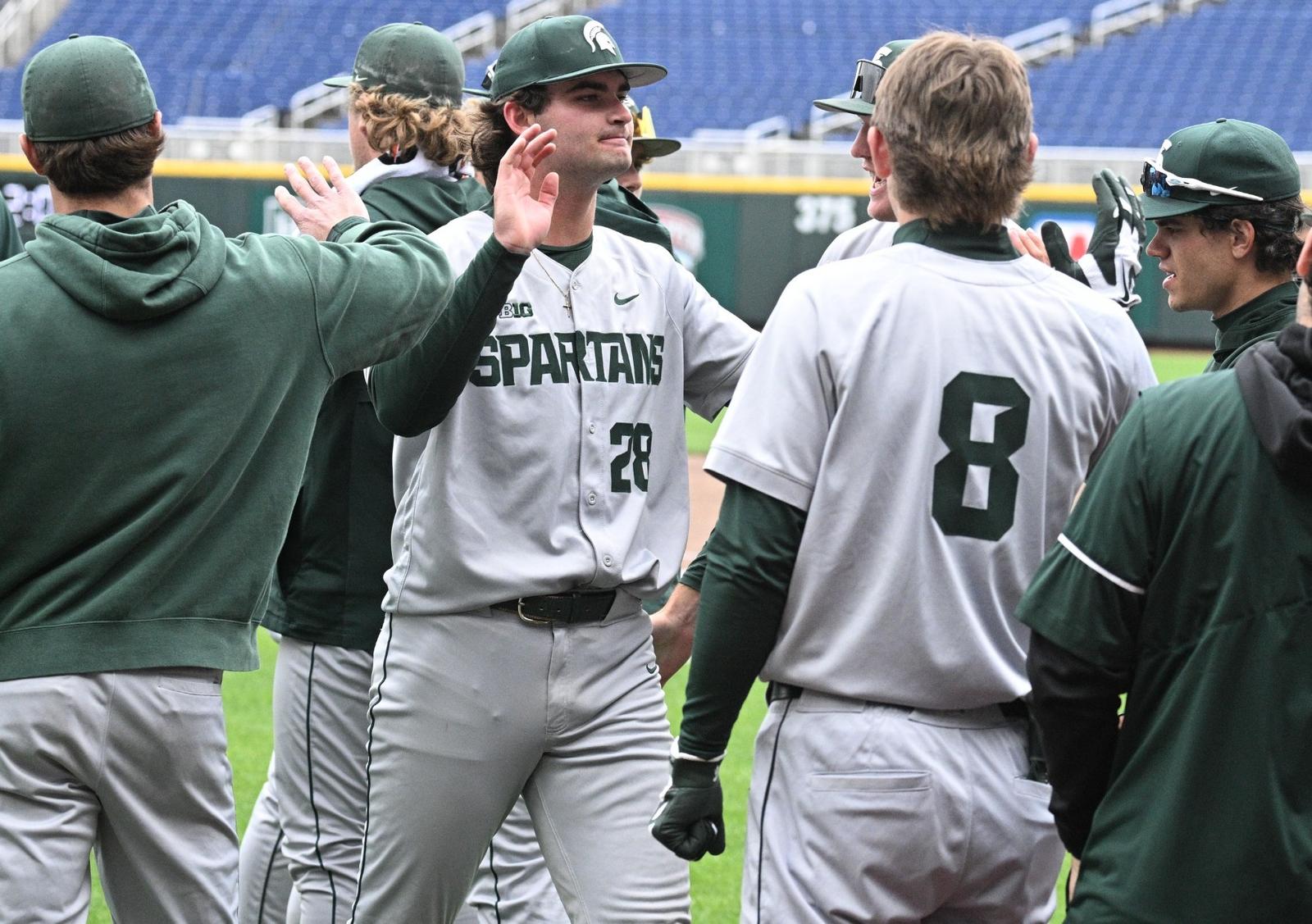 Aidan Donovan is congratulated by teammates during the Big Ten Tournament game vs. Purdue at Charles Schwab Field Omaha in Omaha, Nebraska on May 19, 2026