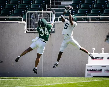 Fredrick Moore catches a pass during a spring practice in Spartan Stadium.