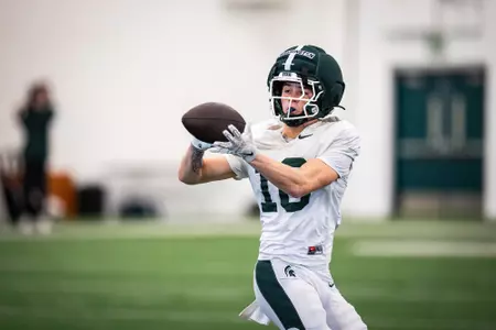 Zach Washington catches a pass at spring practice.