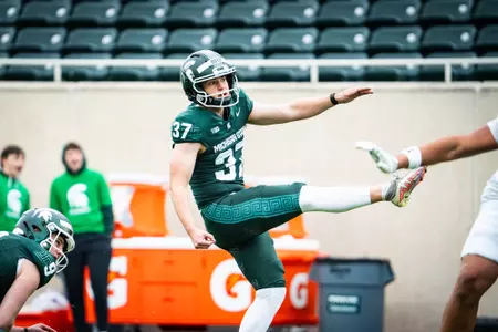 Liam Boyd kicks a ball during the 2026 Spring Showcase in Spartan Stadium.