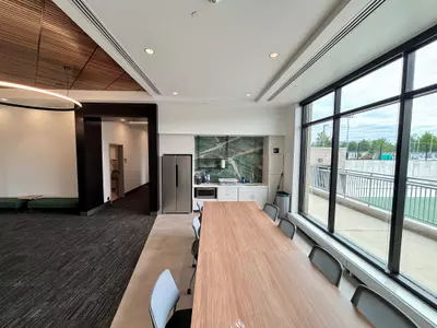 A view of the kitchen and nutrition station at Spartan Tennis, with the patio on the right overlooking the new outdoor courts.
