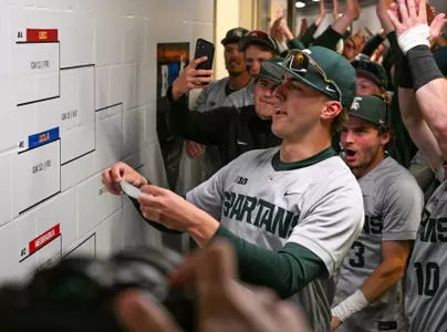 Nolan Higgins applies Michigan State's sticker to the 2026 Big Ten Baseball Tournament after the Victory for MSU over Iowa on May 20, 2026.