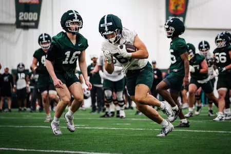 Joe Caudill runs during a drill at spring practice.