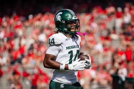 Bryson Williams goes through warm-ups at Nebraska in 2025.