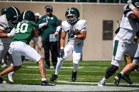 Jace Clarizo runs the ball during a scrimmage at spring practice in 2026.