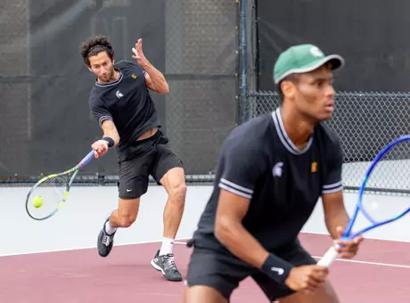 Ozan Baris and Matthew Forbes in doubles action at the NCAA Tournament.