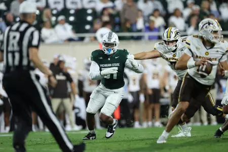 Kekai Burnett rushes the passer in the 2025 season opener against Western Michigan.