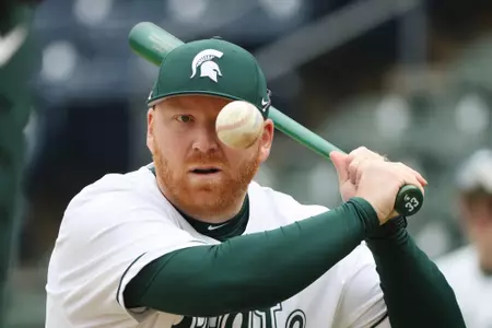 Coach Gelly eye on ball during warm-ups of MSU vs Illinois game at Fluor Field in Greenville, SC