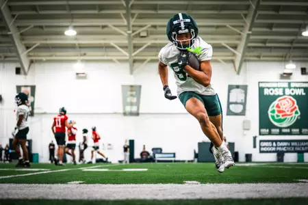 Nick Hardy goes through a drill at spring practice in the Greg and Dawn Williams Indoor Practice Facility.