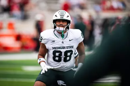 Kai Rios warms up prior to the Indiana game in October 2025.
