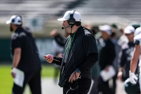 Nick Sheridan coaches on the sideline during spring practice in April 2026.