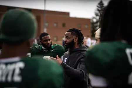 Hank Poteat coaches the cornerbacks at spring practice for the Spartans.