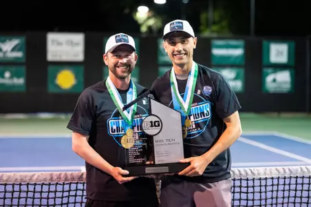 Coach Mike Flowers and Coach Harry Jadun with the Big Ten Tournament trophy at Big Ten Tournament Championship at Ojai, Calif.