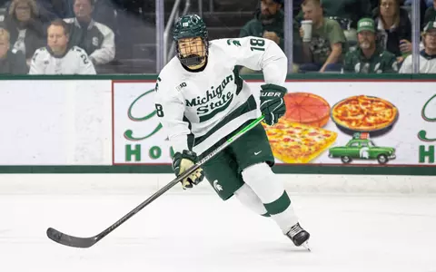 Ryker Lee on the ice skating against Wisconsin at Munn Ice Arena