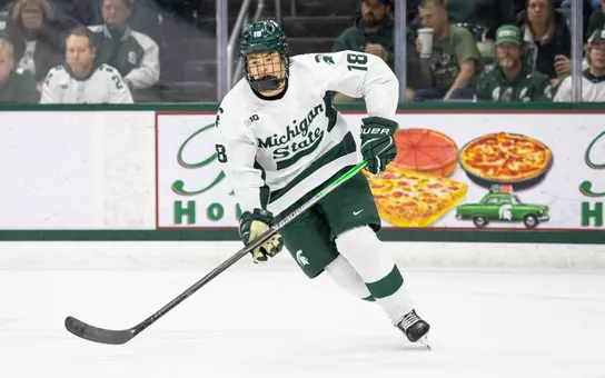Ryker Lee on the ice skating against Wisconsin at Munn Ice Arena
