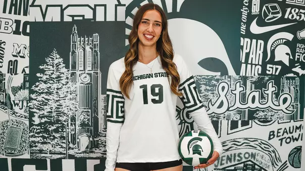 Hayley Ogden stands with a volleyball