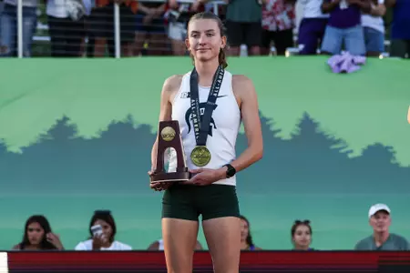 Kate Stewart-Barnett at the podium at the NCAA Championships