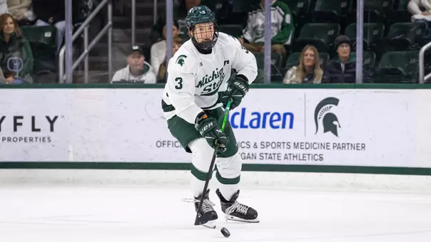 Sean Barnhill handles the puck at Munn Ice Arena