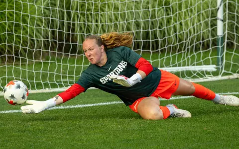 Noelle Henning warms up prior to the season opener against Xavier