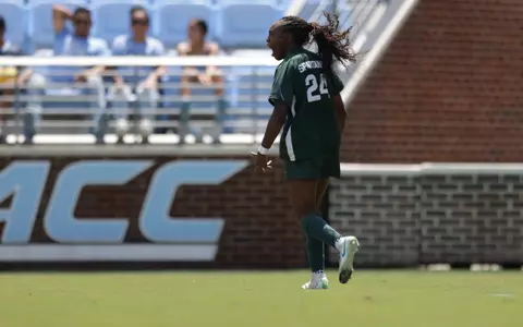 Kennedy Bell celebrates her first of two goals at North Carolina