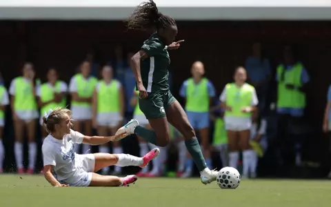 Kennedy Bell goes to goal for her first of two scores on the road at North Carolina